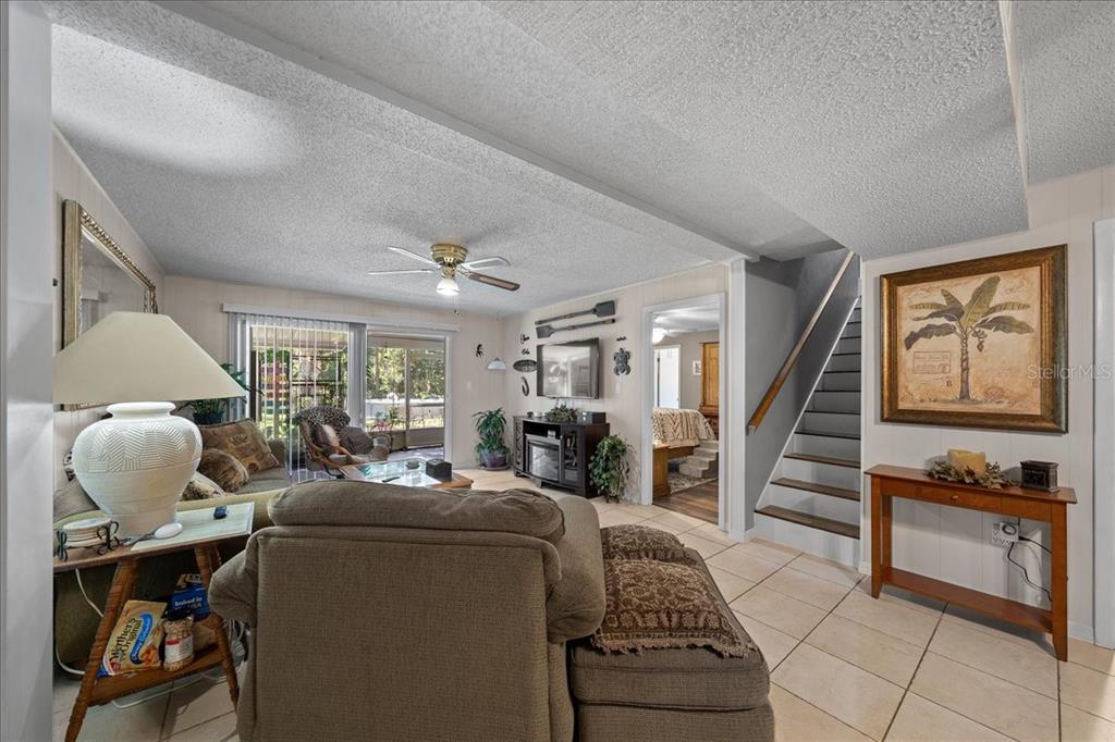 430 Southwest 43rd Place Ocala, FL 34471 - Photo 32 of 83 a living room with furniture and a flat screen tv