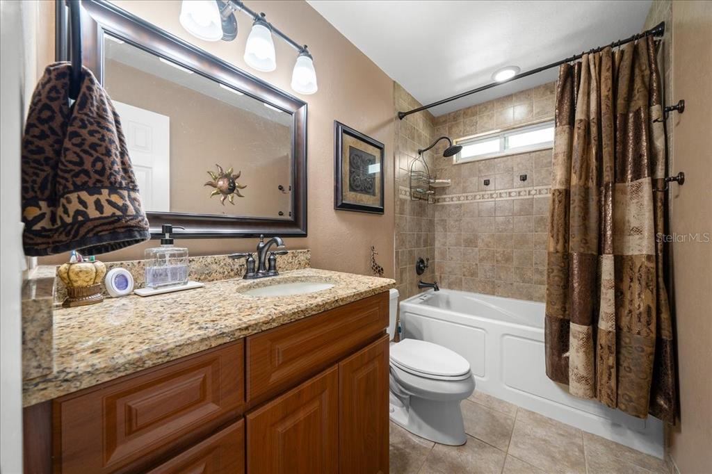 430 Southwest 43rd Place Ocala, FL 34471 - Photo 35 of 83 a bathroom with a granite countertop sink toilet and shower