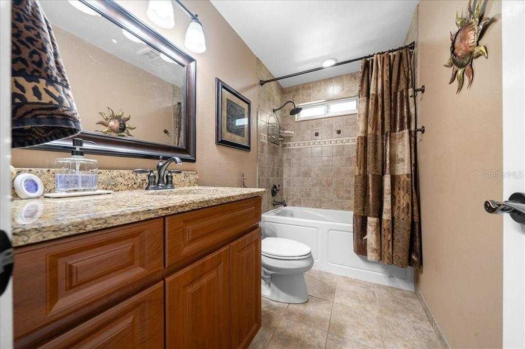 430 Southwest 43rd Place Ocala, FL 34471 - Photo 36 of 83 a bathroom with a granite countertop sink toilet and shower