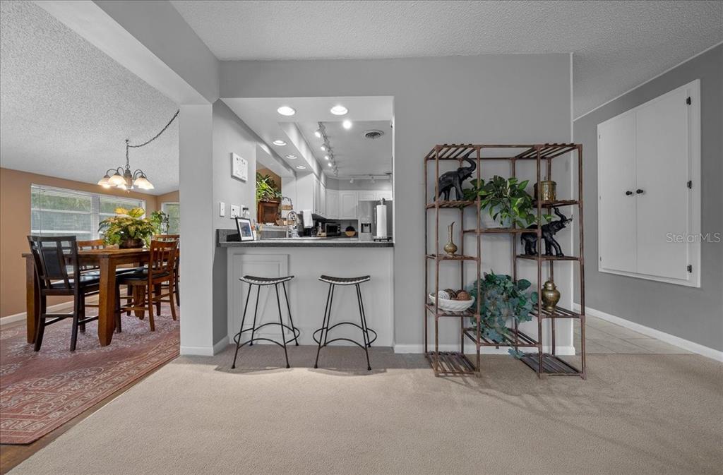 430 Southwest 43rd Place Ocala, FL 34471 - Photo 37 of 83 a kitchen with stainless steel appliances a table and chairs in it