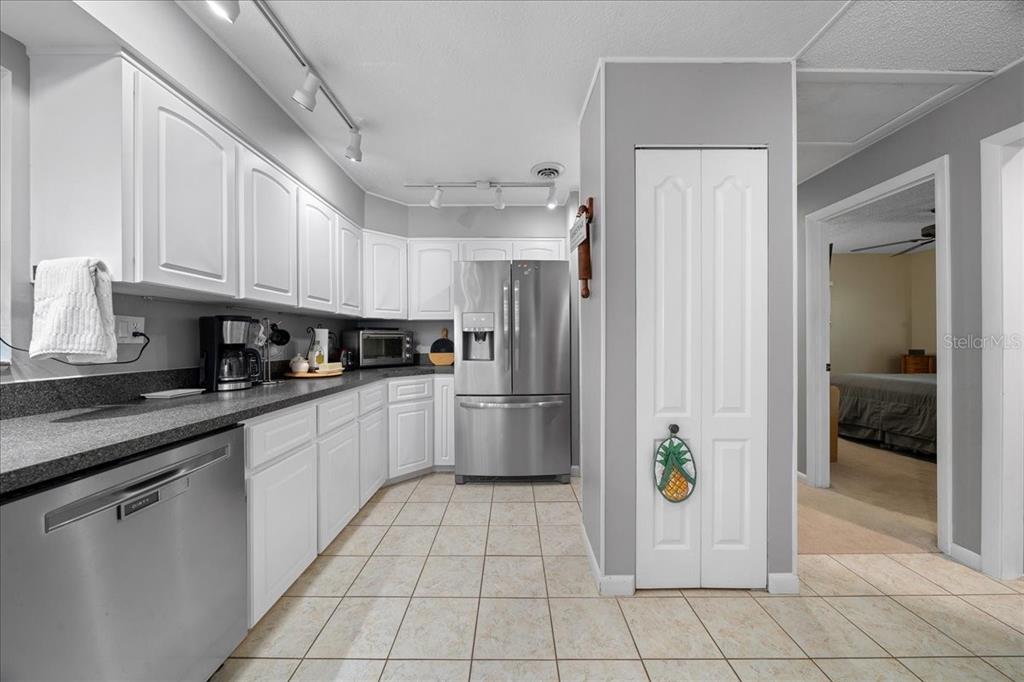 430 Southwest 43rd Place Ocala, FL 34471 - Photo 41 of 83 a kitchen with stainless steel appliances granite countertop a refrigerator and a sink