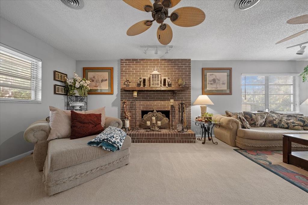 430 Southwest 43rd Place Ocala, FL 34471 - Photo 48 of 83 a living room with furniture and a fireplace