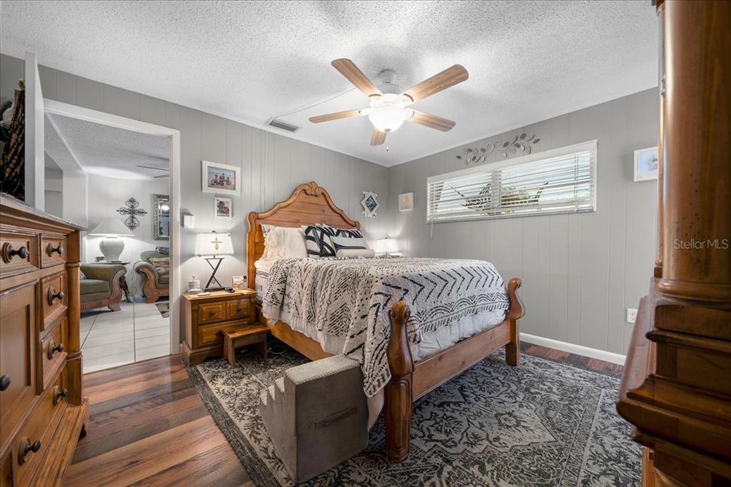 430 Southwest 43rd Place Ocala, FL 34471 - Photo 49 of 83 a bedroom with bed and wooden floor