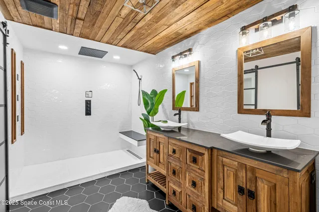 a bathroom with a double vanity sink and a bathtub