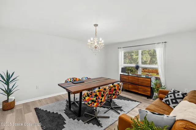 a bedroom with furniture and a chandelier