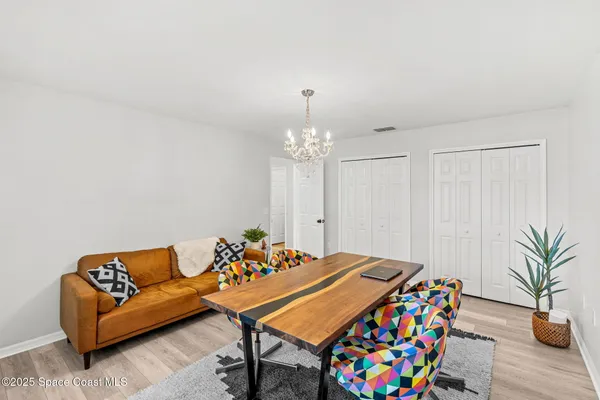 a view of an house with backyard and tree