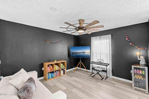 a view of a backyard with a small cabin and a chair