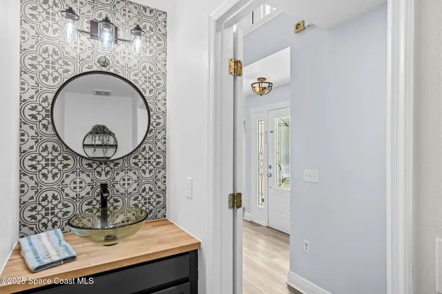 a view of a livingroom with furniture and mirror