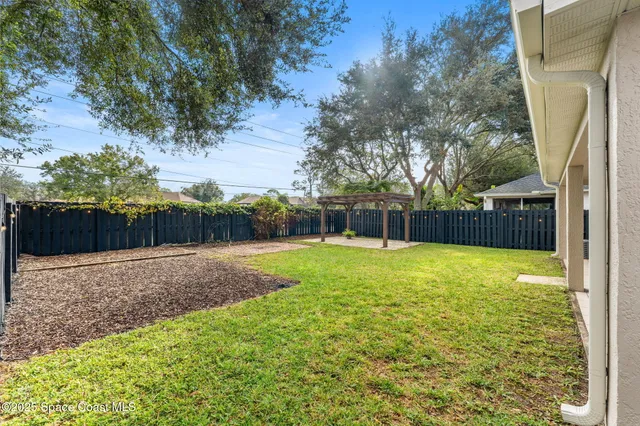 a swimming pool with wooden fence