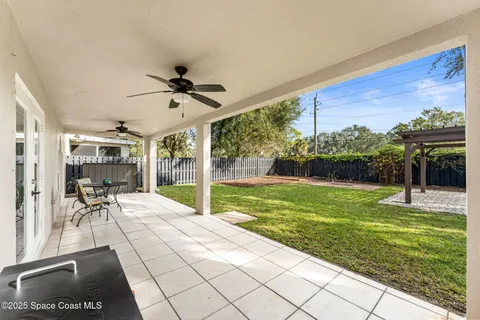 a view of a porch with furniture and yard