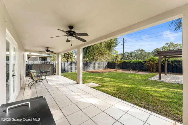 a view of a porch with furniture and yard