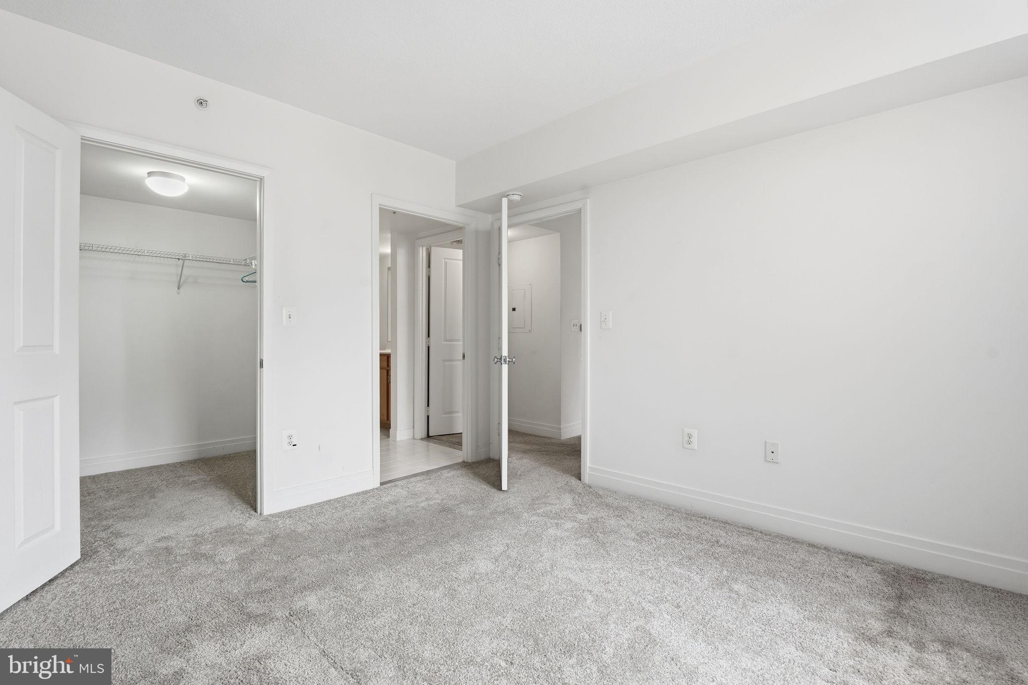 414 Water Street, Unit 1304 Baltimore, MD 21202 - Photo 15 of 24 an empty room with closet area