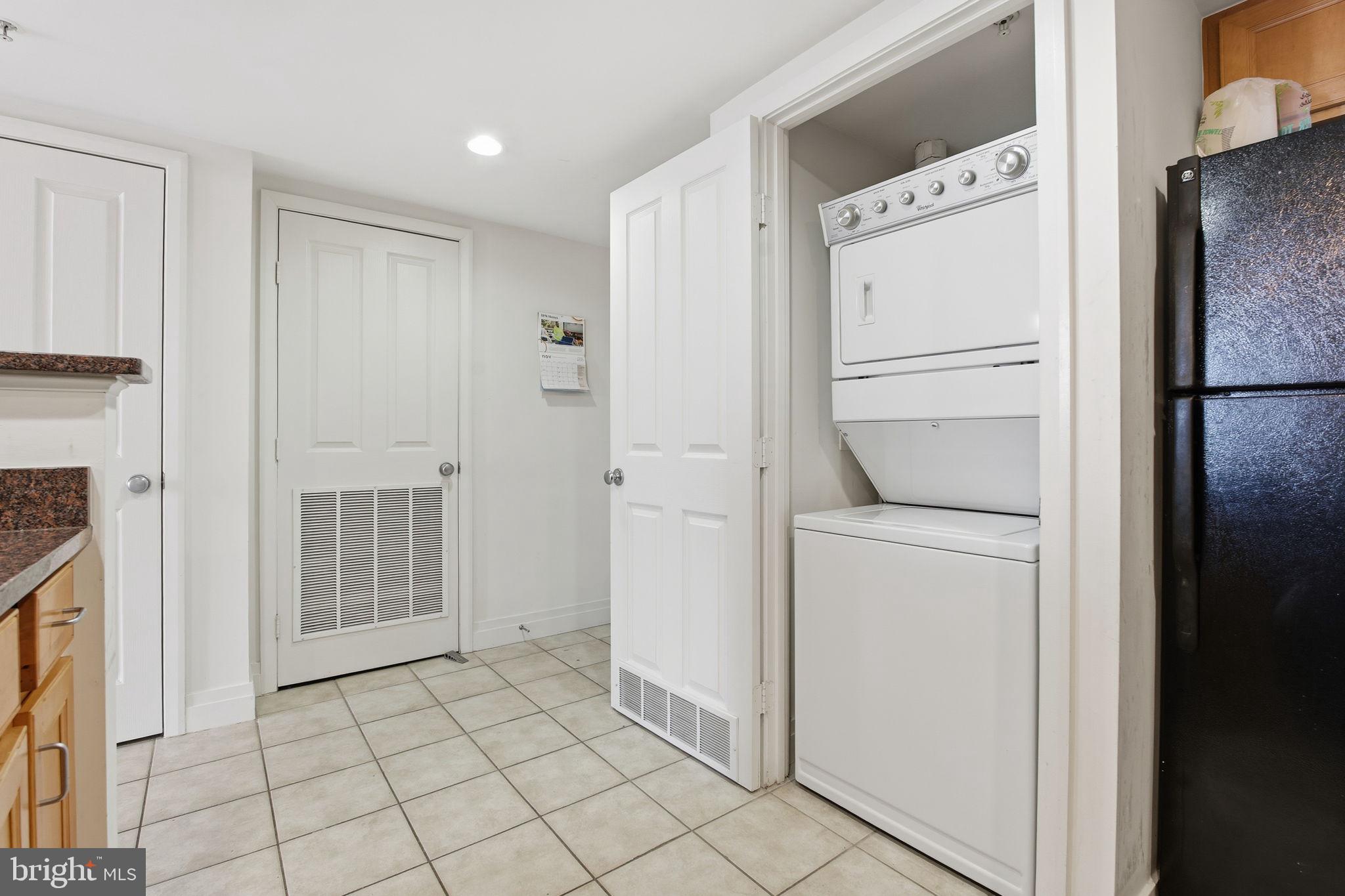 414 Water Street, Unit 1304 Baltimore, MD 21202 - Photo 20 of 24 a view of a storage & utility room with washer and dryer