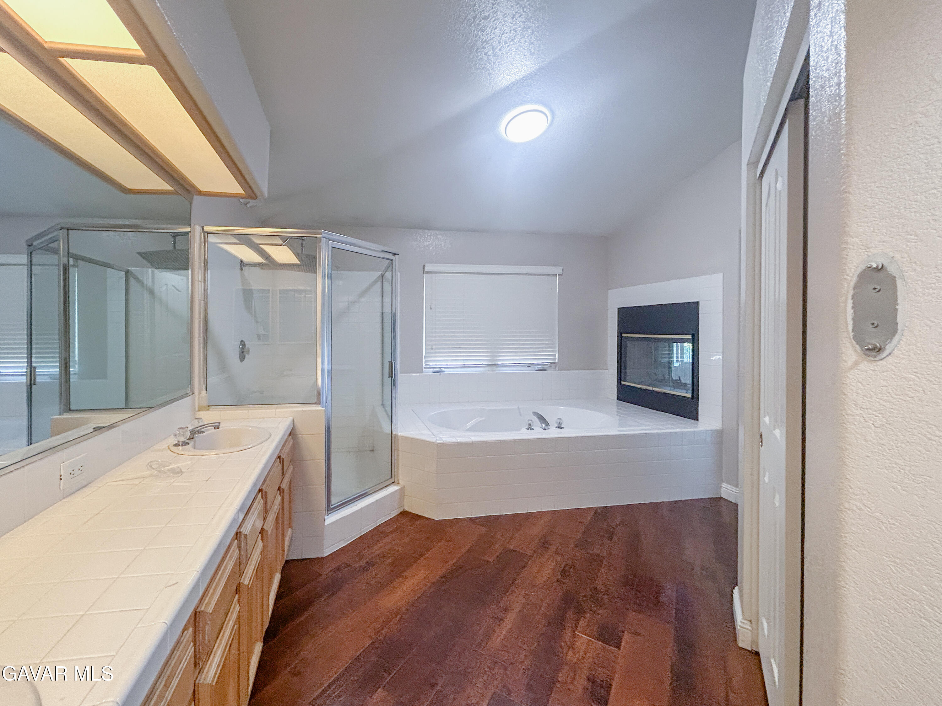 4011 Dee Dee Court Lancaster, CA 93536 - Photo 14 of 41 a bathroom with a tub sink and mirror
