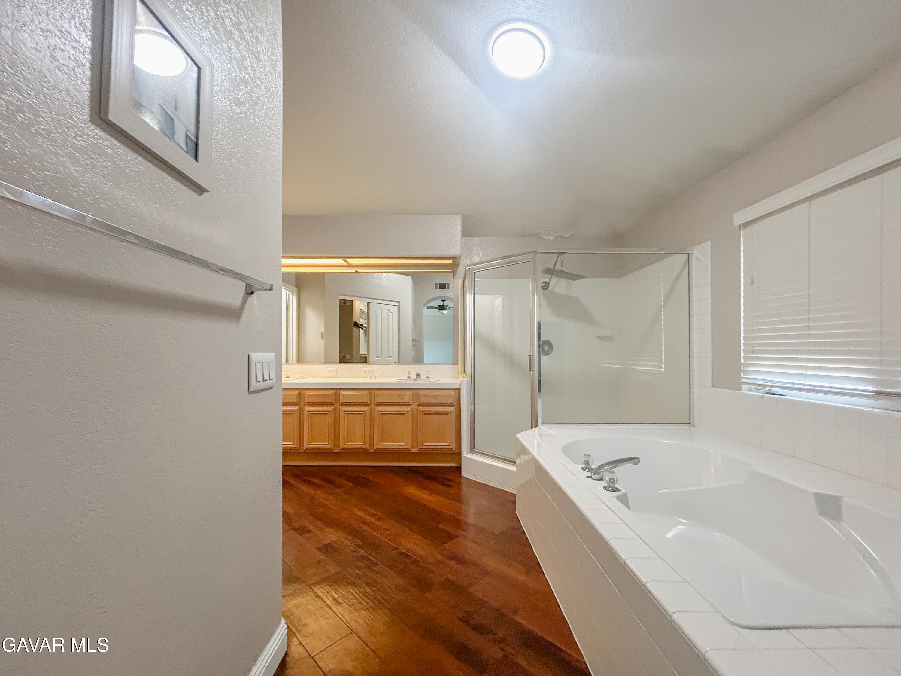 4011 Dee Dee Court Lancaster, CA 93536 - Photo 16 of 41 a bathroom with a tub and shower