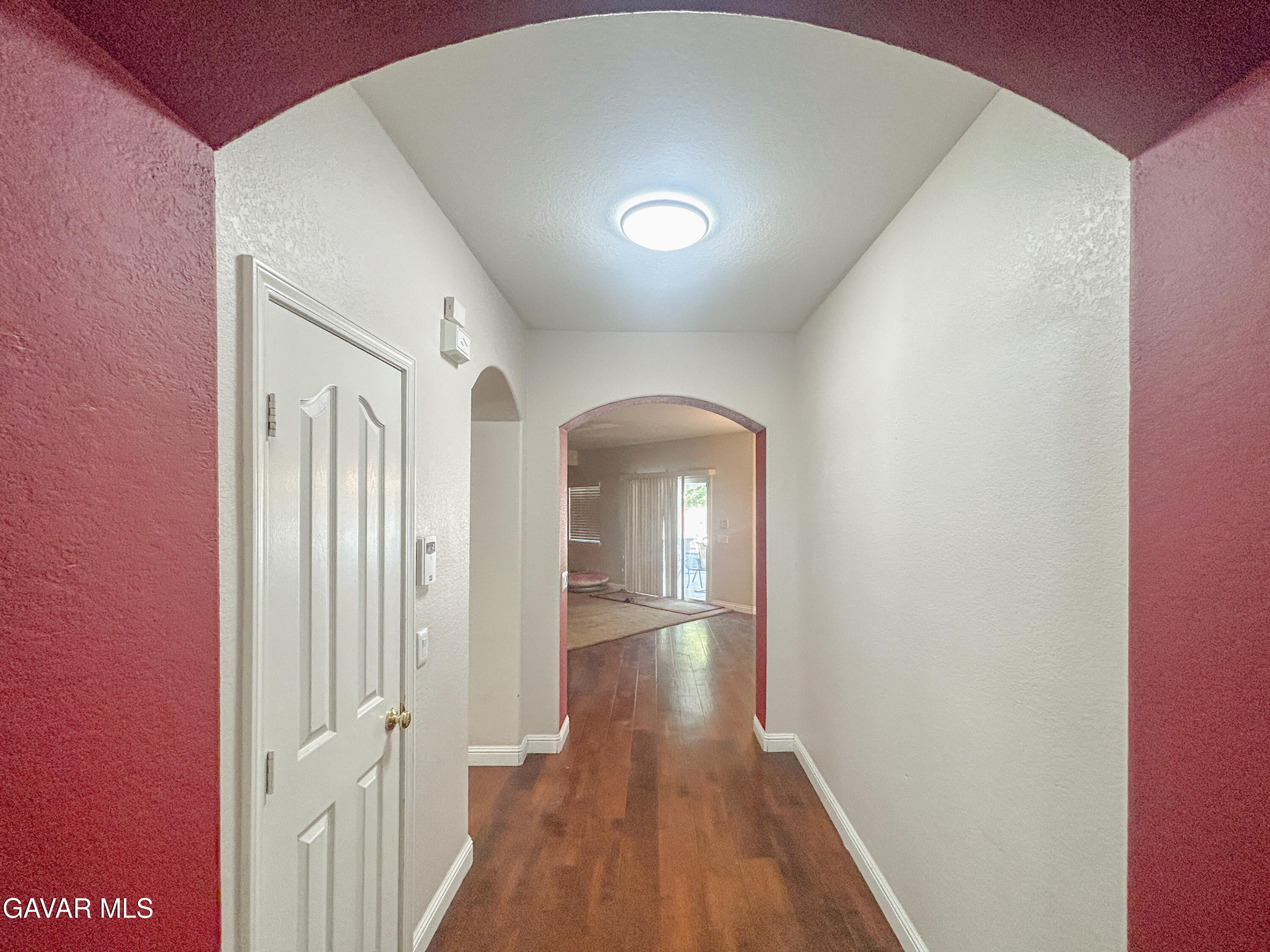 4011 Dee Dee Court Lancaster, CA 93536 - Photo 17 of 41 a view of a hallway with wooden floor