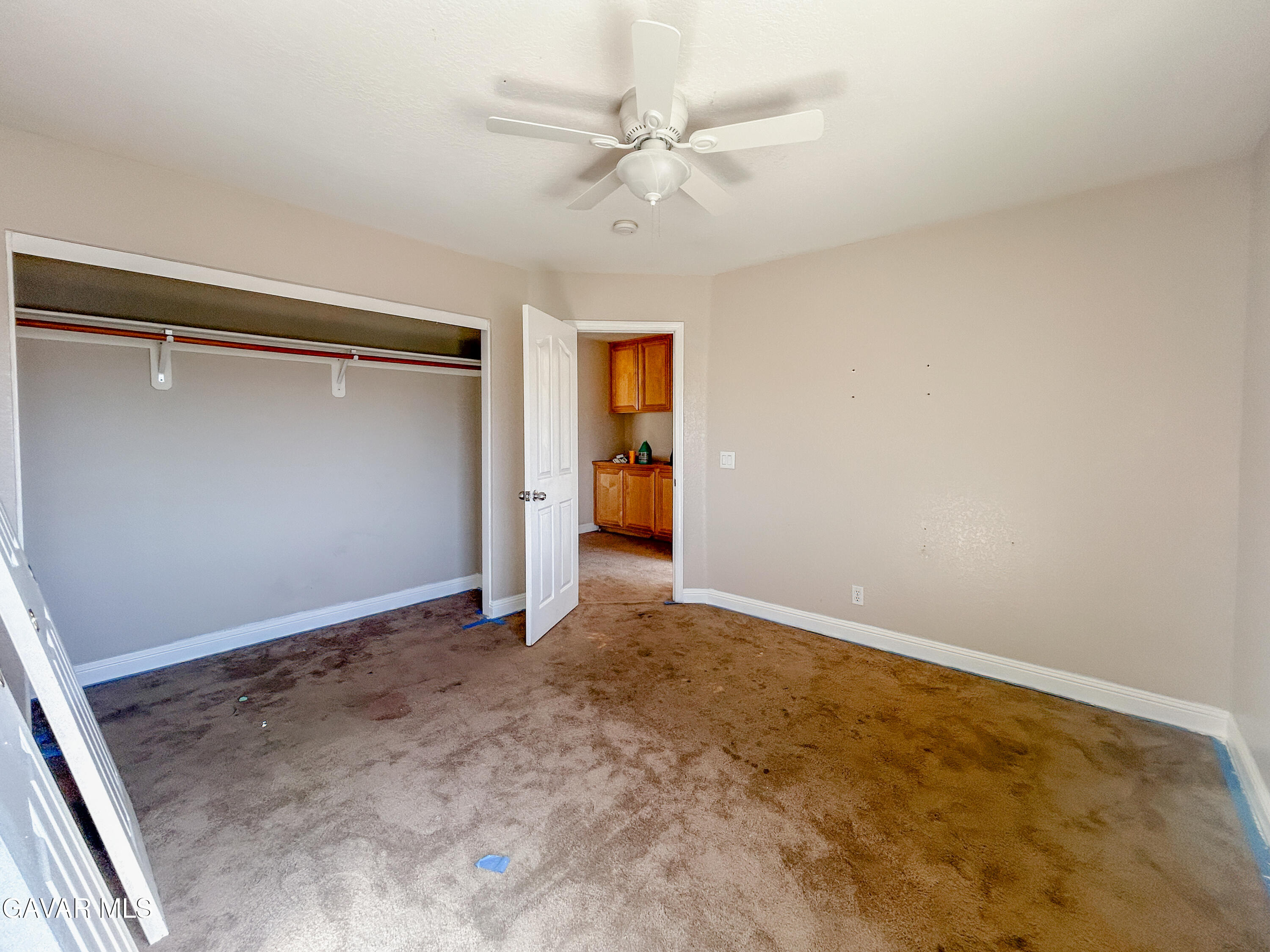 4011 Dee Dee Court Lancaster, CA 93536 - Photo 22 of 41 an empty room with closet and a ceiling fan