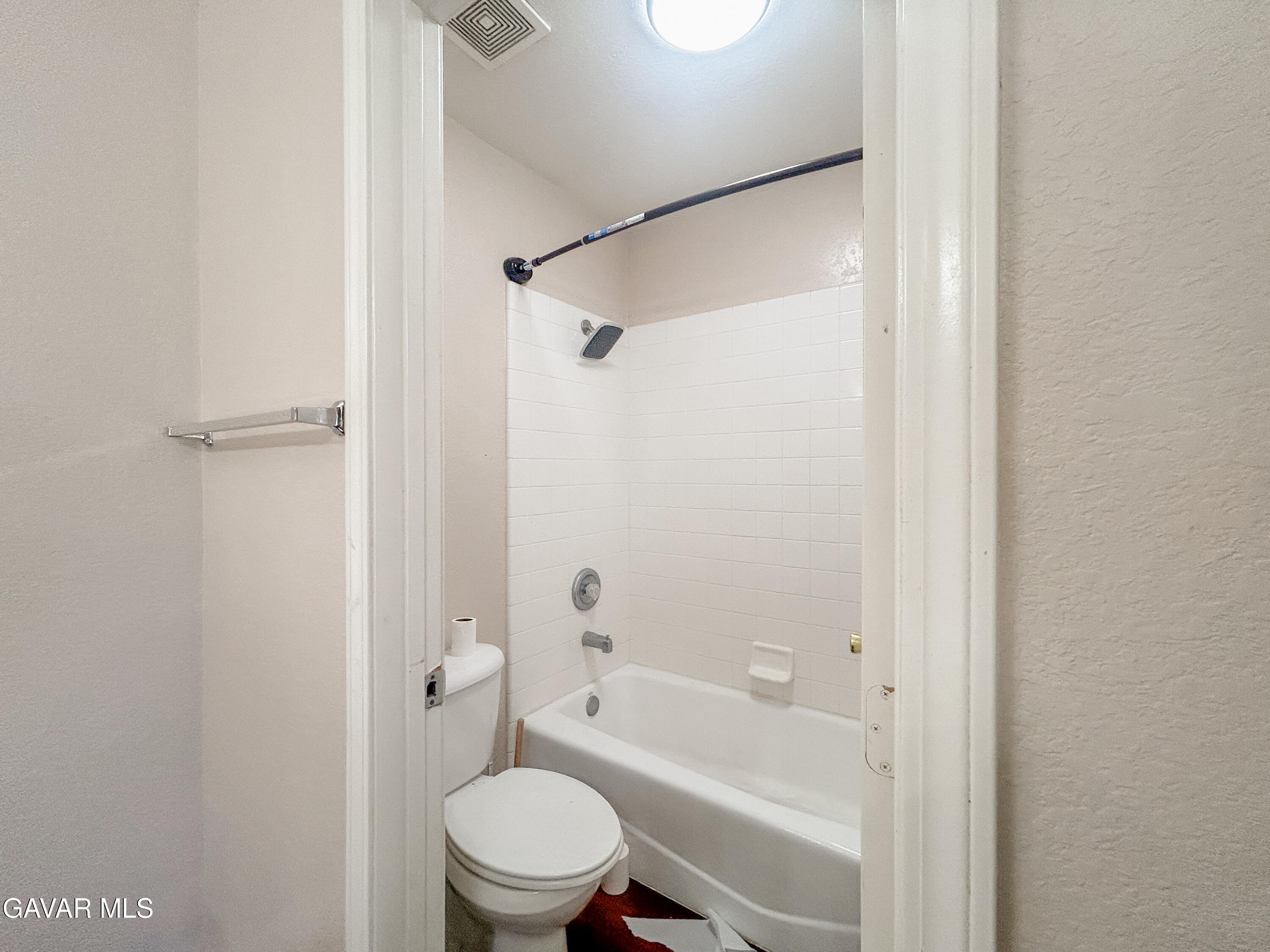 4011 Dee Dee Court Lancaster, CA 93536 - Photo 27 of 41 a bathroom with a toilet and a bathtub