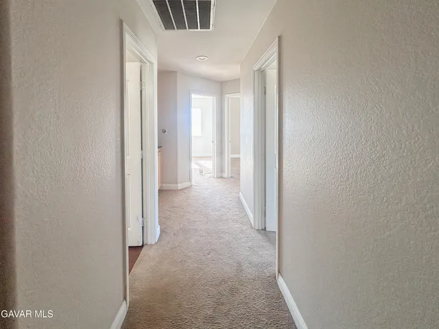 a view of a hallway with entryway