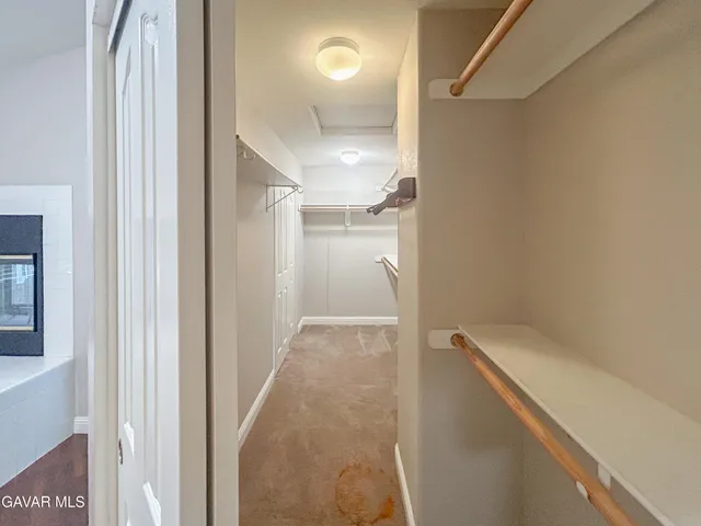 a view of hallway with stairs and a shower