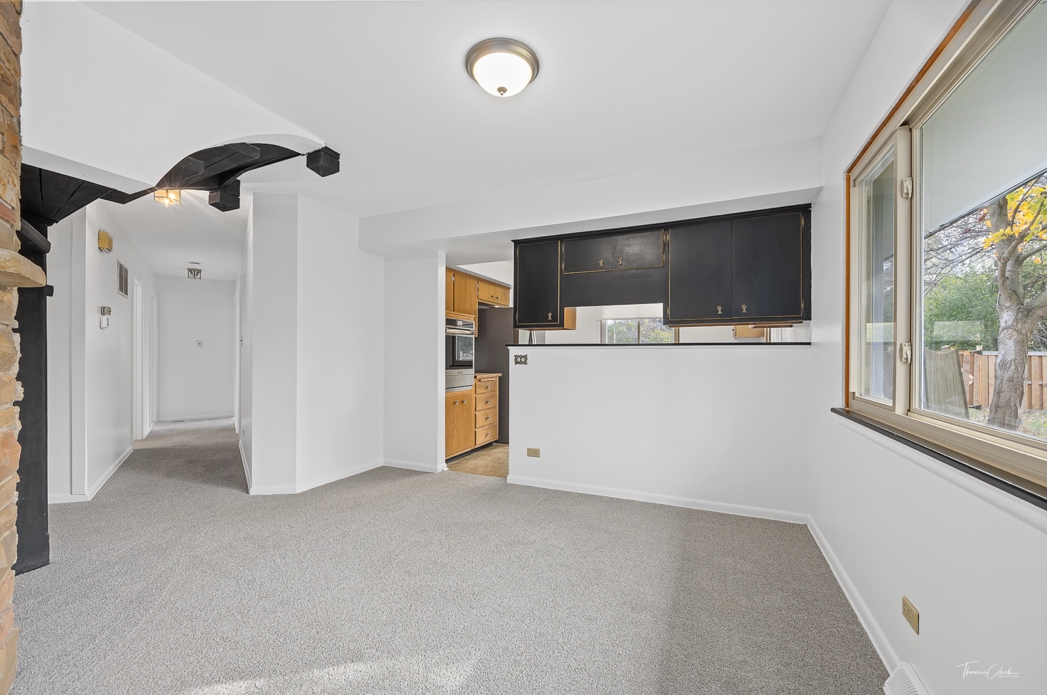 853 Cramer Court Willowbrook, IL 60527 - Photo 19 of 32 a view of a livingroom with wooden floor and a flat screen tv