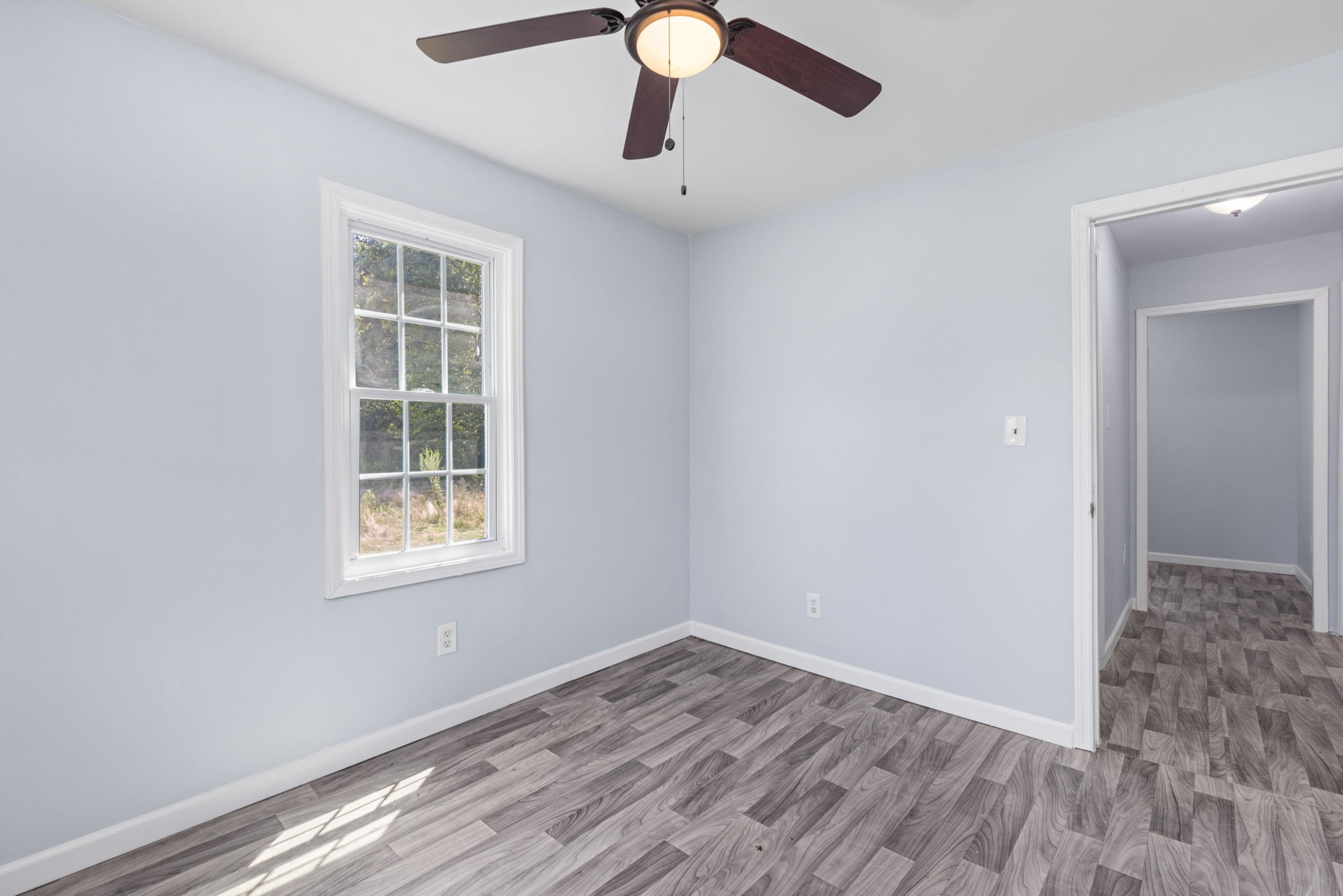 2732 Railroad Bed Road Iron City, TN 38463 - Photo 13 of 44 an empty room with wooden floor cabinet and windows