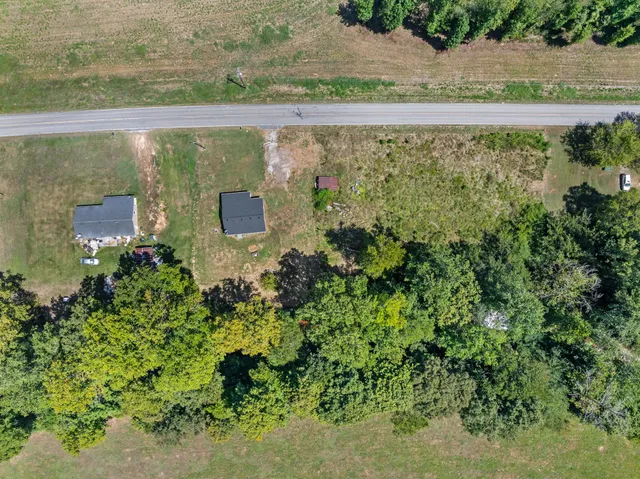 a view of a lake with a yard
