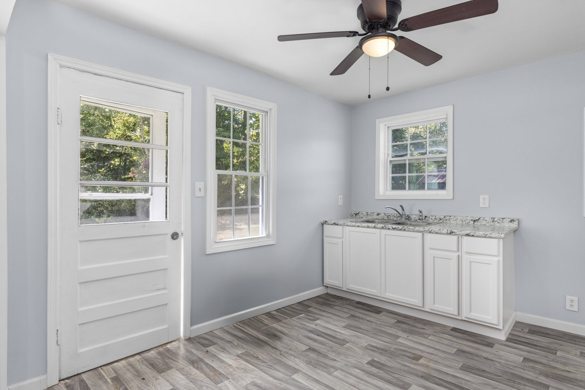 2732 Railroad Bed Road Iron City, TN 38463 - Photo 5 of 44 a view of an empty room with a window and wooden floor