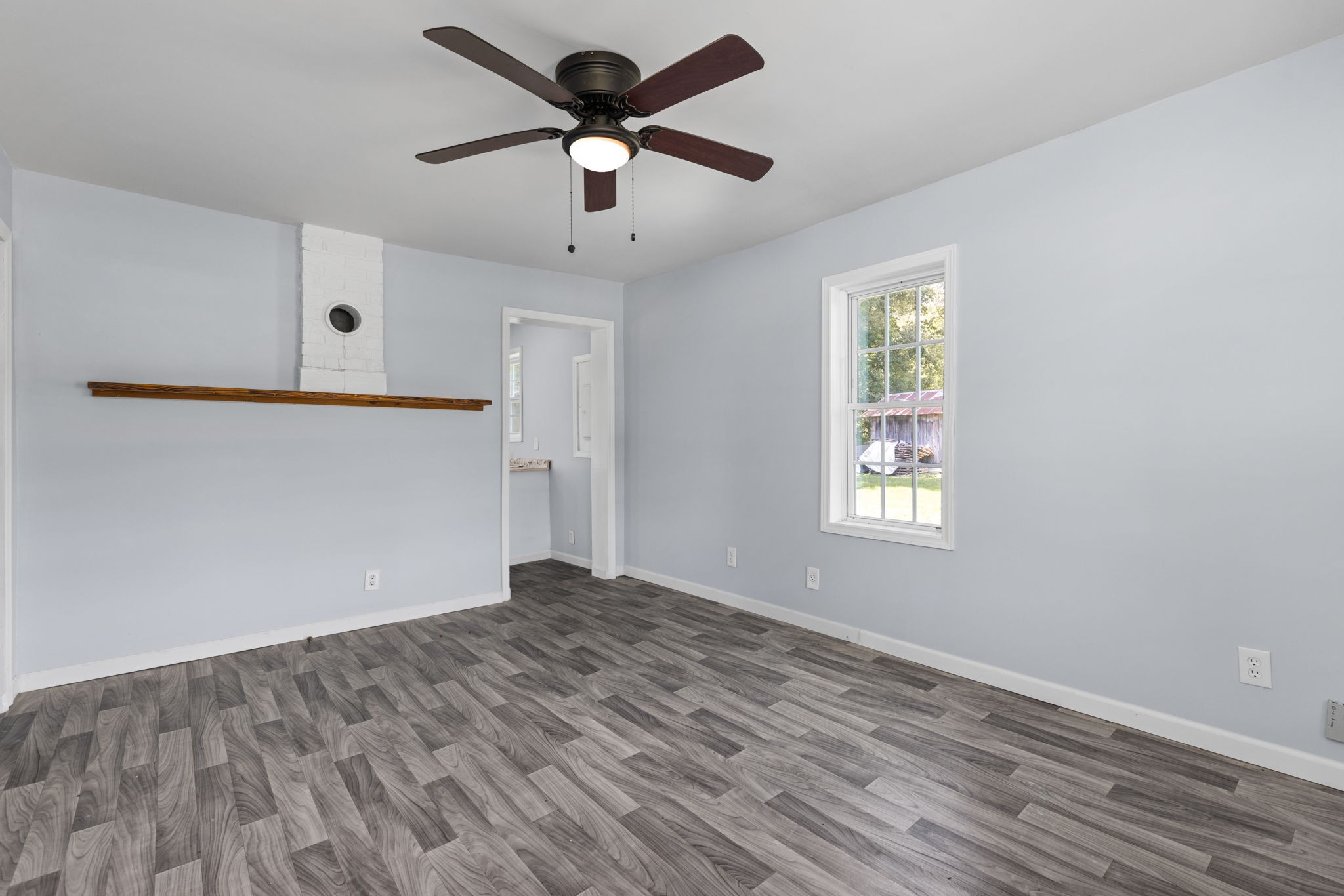 2732 Railroad Bed Road Iron City, TN 38463 - Photo 7 of 44 wooden floor in an empty room with a window