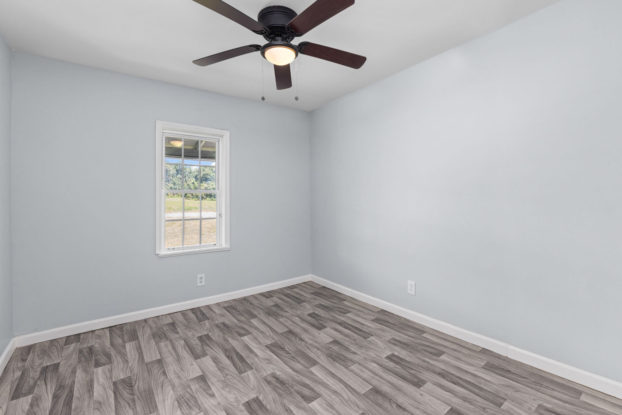 2732 Railroad Bed Road Iron City, TN 38463 - Photo 8 of 44 an empty room with a window and a fan