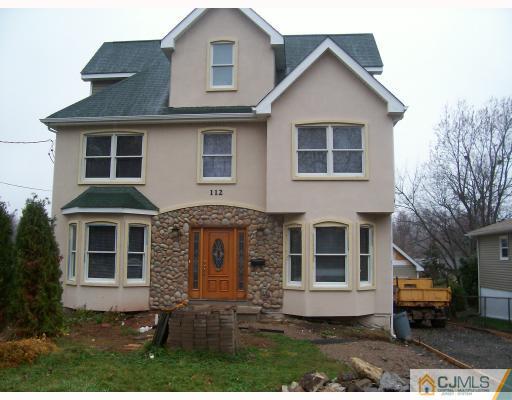 112 Oxford Road Colonia, NJ 07067 - Photo 1 of 1 a front view of a house with garden