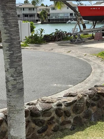 a living room with furniture and a mirror