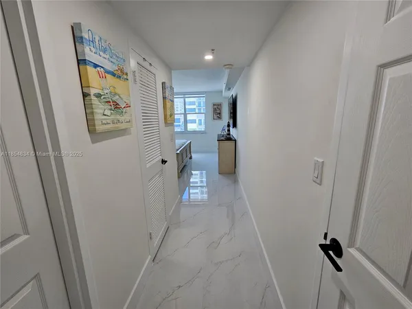 a view of hallway with a window