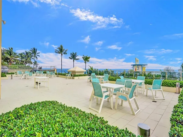 a view of a terrace with sitting area