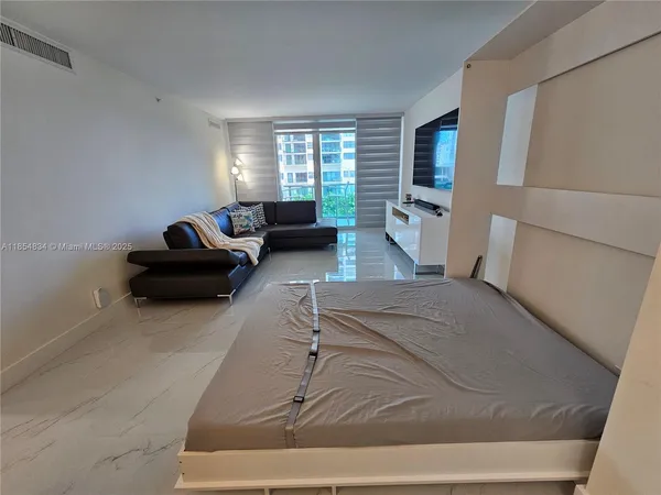 a living room with furniture and a window