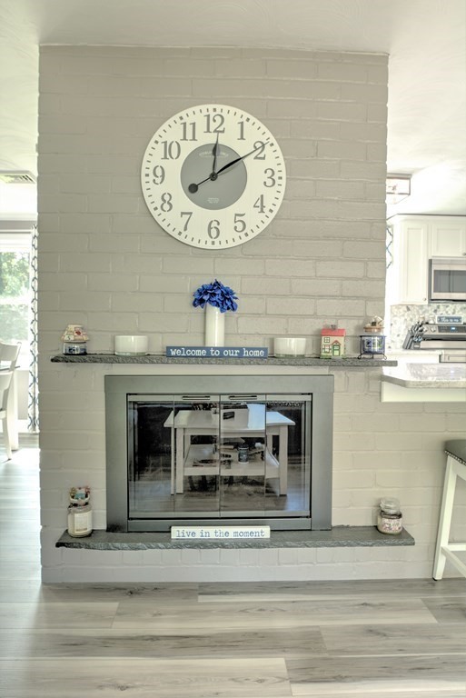 44 Ruthellen Road Chelmsford, MA 01824 - Photo 12 of 42 a view of a kitchen with a sink and a clock on the wall