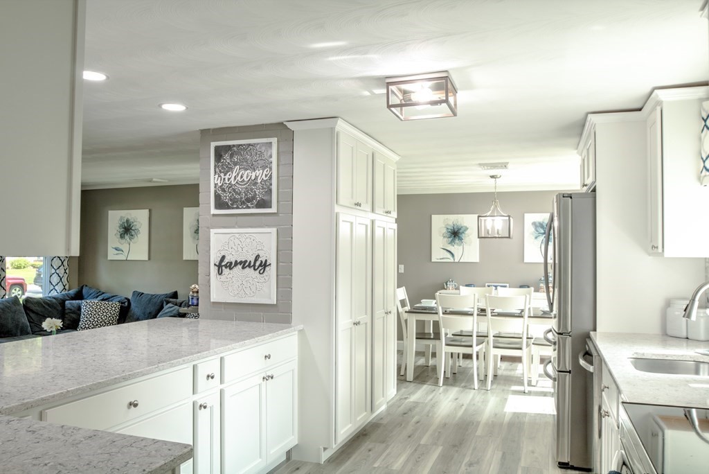 44 Ruthellen Road Chelmsford, MA 01824 - Photo 19 of 42 a large kitchen with a table and chairs