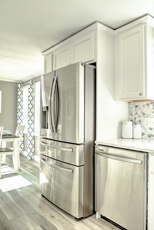 44 Ruthellen Road Chelmsford, MA 01824 - Photo 21 of 42 a kitchen with stainless steel appliances a refrigerator and a sink