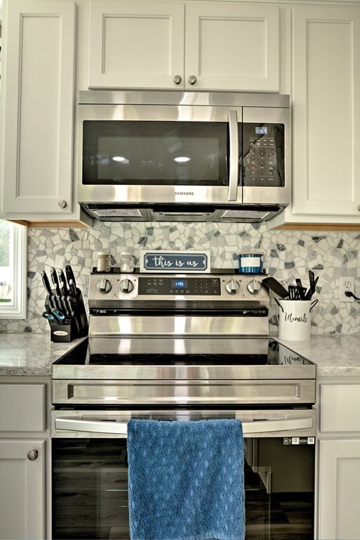 44 Ruthellen Road Chelmsford, MA 01824 - Photo 22 of 42 a stove top oven sitting inside of a kitchen