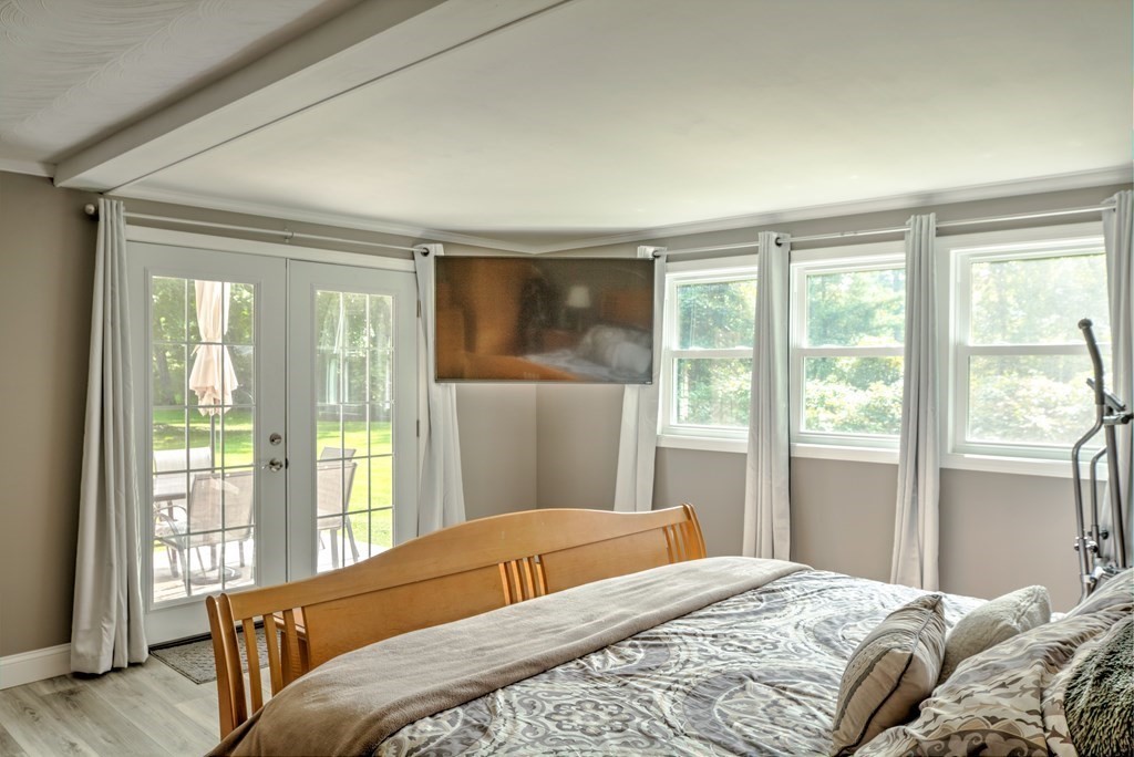 44 Ruthellen Road Chelmsford, MA 01824 - Photo 24 of 42 a bedroom with a large window and a bed