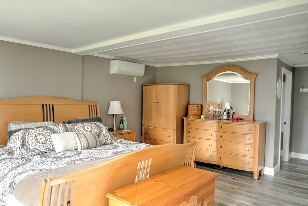 44 Ruthellen Road Chelmsford, MA 01824 - Photo 25 of 42 a bedroom with a bed and a dresser