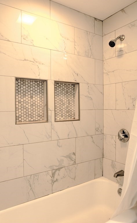 44 Ruthellen Road Chelmsford, MA 01824 - Photo 30 of 42 a bathroom with a bathtub and shower