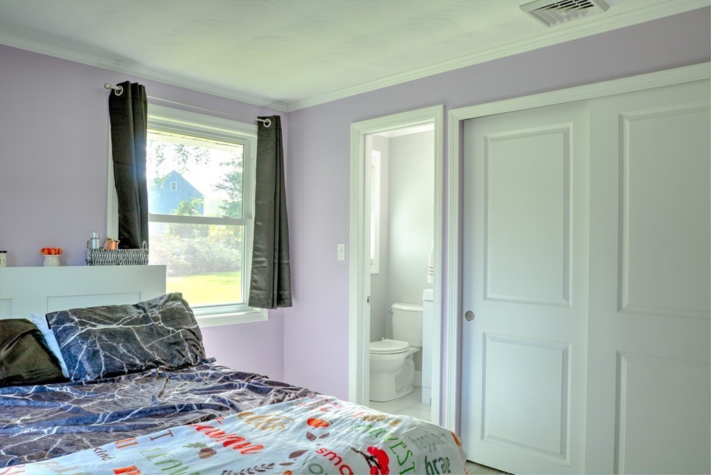 44 Ruthellen Road Chelmsford, MA 01824 - Photo 35 of 42 a bedroom with a bed and a window