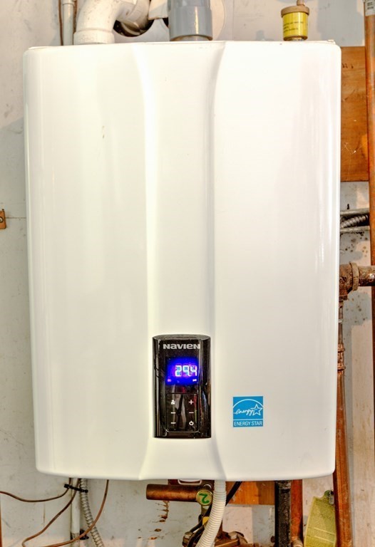 44 Ruthellen Road Chelmsford, MA 01824 - Photo 39 of 42 a wall with a painting on the wall and a table