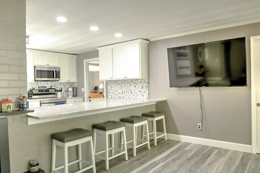 44 Ruthellen Road Chelmsford, MA 01824 - Photo 9 of 42 a kitchen with a sink cabinets and window