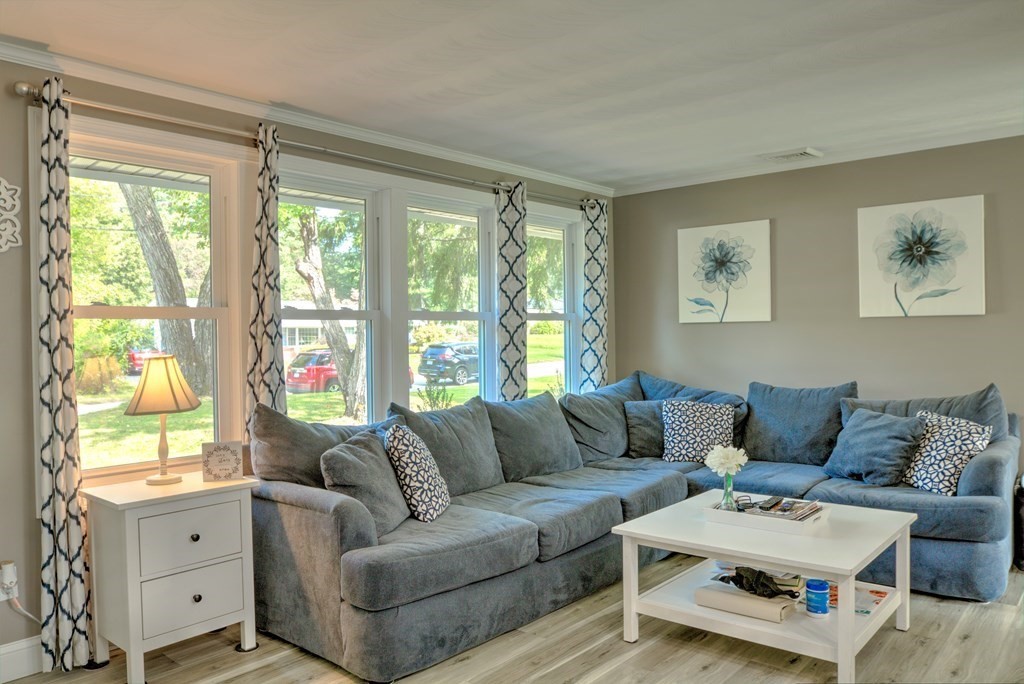 44 Ruthellen Road Chelmsford, MA 01824 - Photo 10 of 42 a living room with furniture and a large window