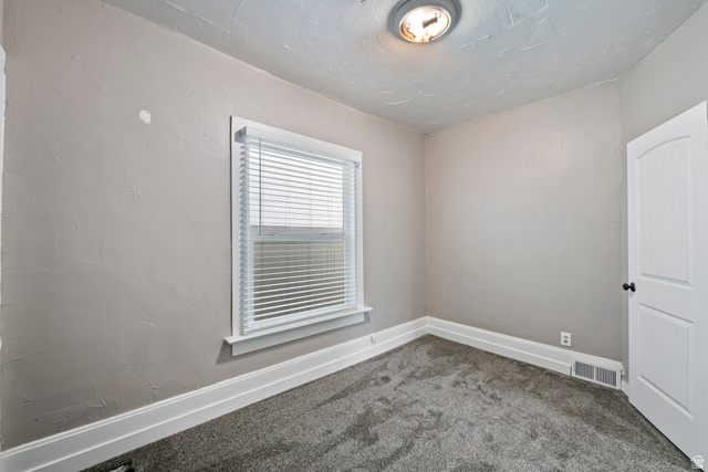 75 600 West Provo, UT 84601 - Photo 15 of 26 Neutral tone wall finish with a single window featuring white blinds and trim