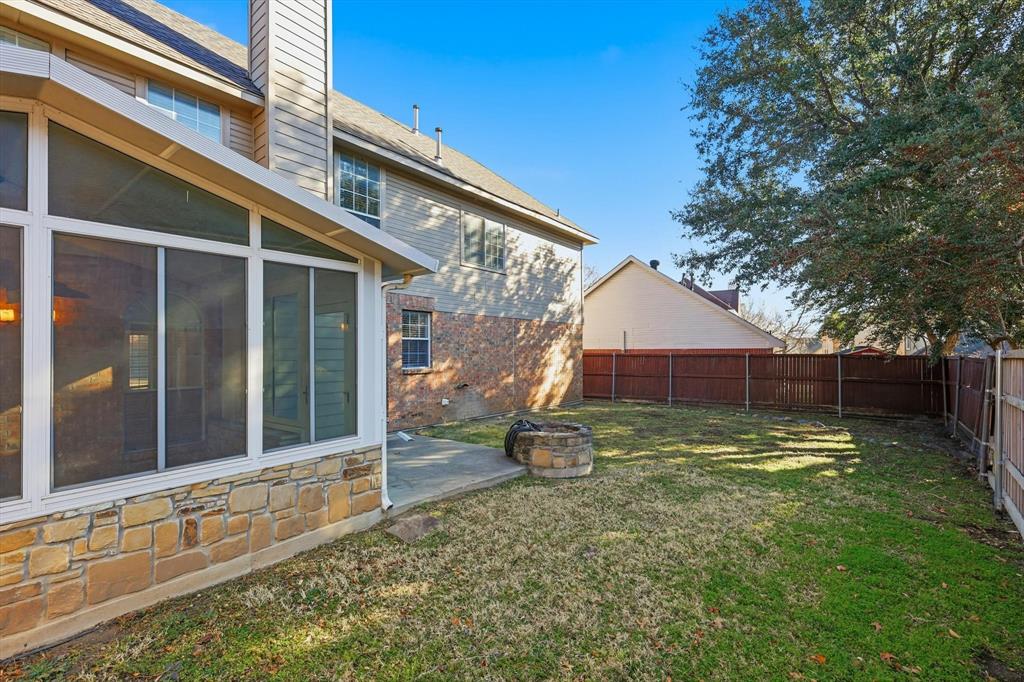 5023 Falcon Hollow Road McKinney, TX 75072 - Photo 24 of 25 Fenced backyard featuring an outdoor fire pit and a patio
