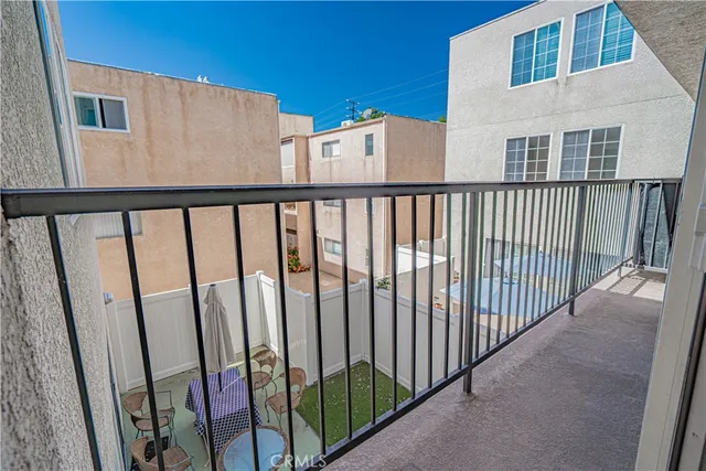 a view of a balcony with wooden fence