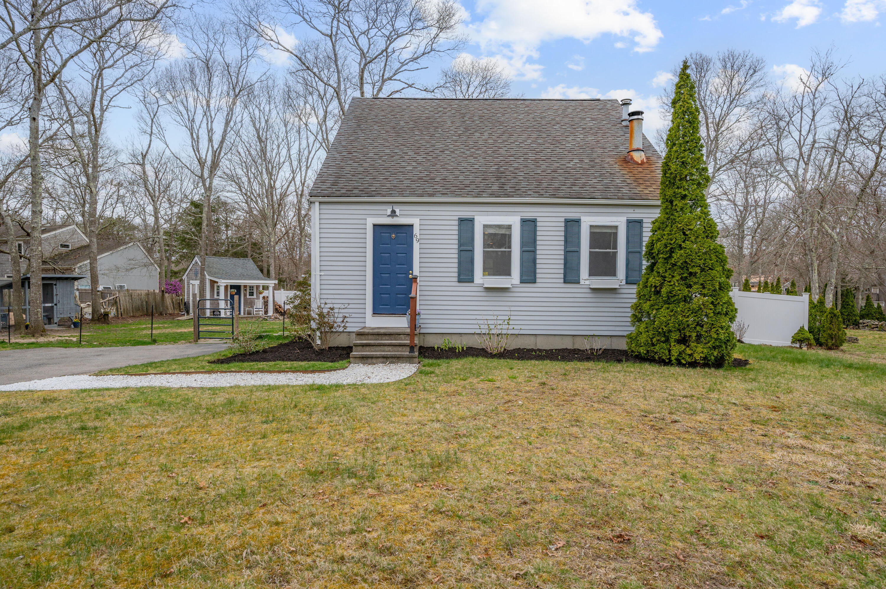 69 Jones Road Marstons Mills, MA 02648 - Photo 19 of 22 a view of a house with a yard and tree